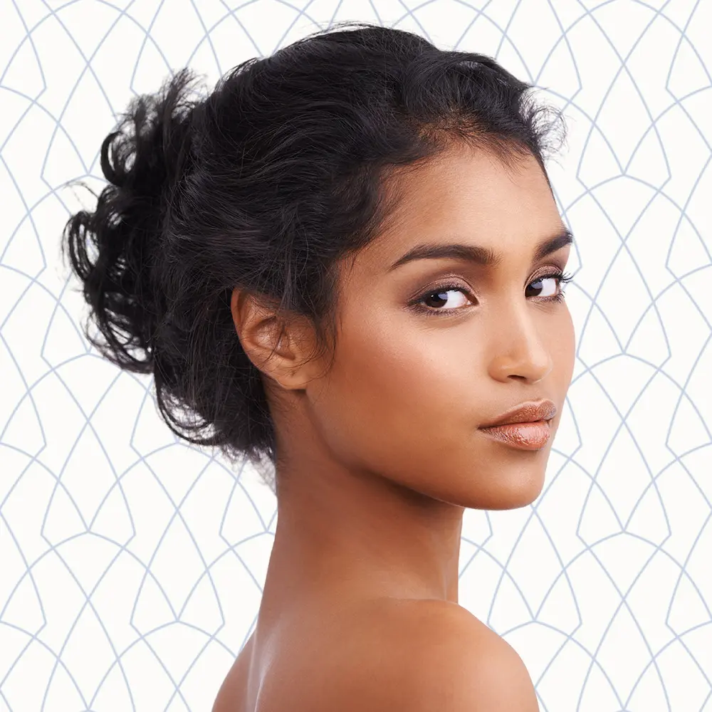 Young and Beautiful Indian Woman Smiling | Facials | Andromeda Medspa