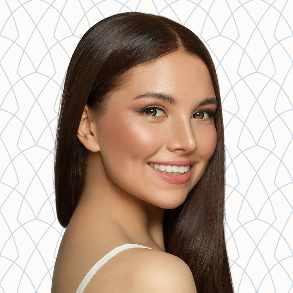 Young Brunette Woman with Smooth Skin Smiling | Injectables | Andromeda Medspa